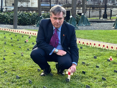 Henry Smith MP plants wooden cross in Constituency Garden of Remembrance in Parliament in honour of Crawley’s fallen